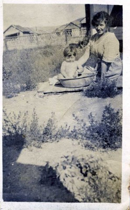 Karen bathing baby Phyllis outdoors in Goldfield, Nevada